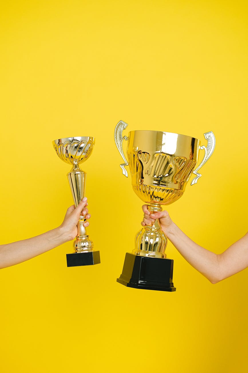 people holding trophies